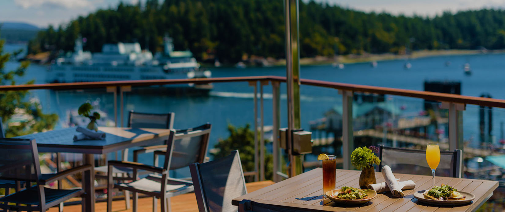Outdoor dining with harbor view